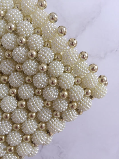Bolso tejido perlas dorado