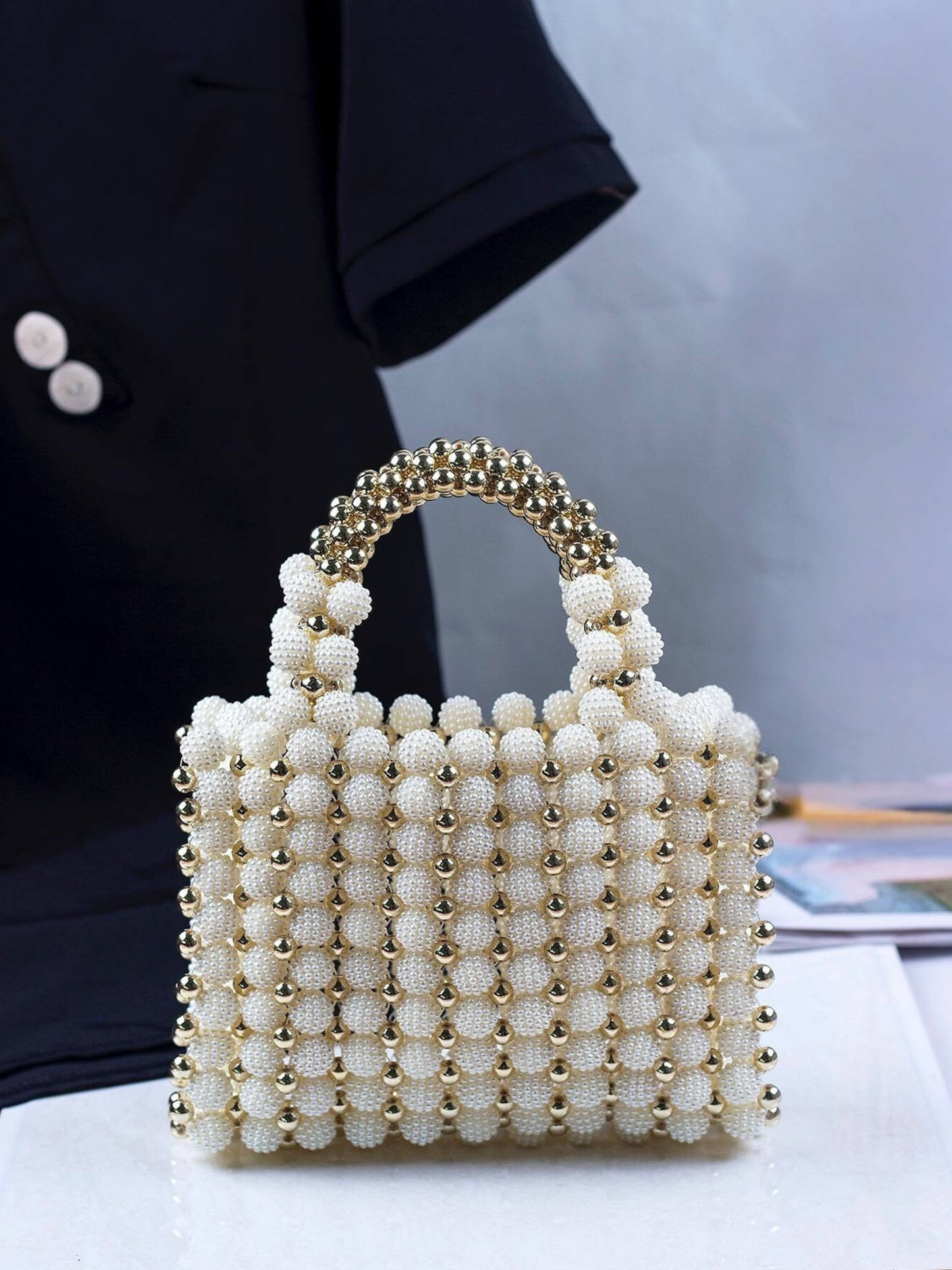 Bolso tejido perlas dorado