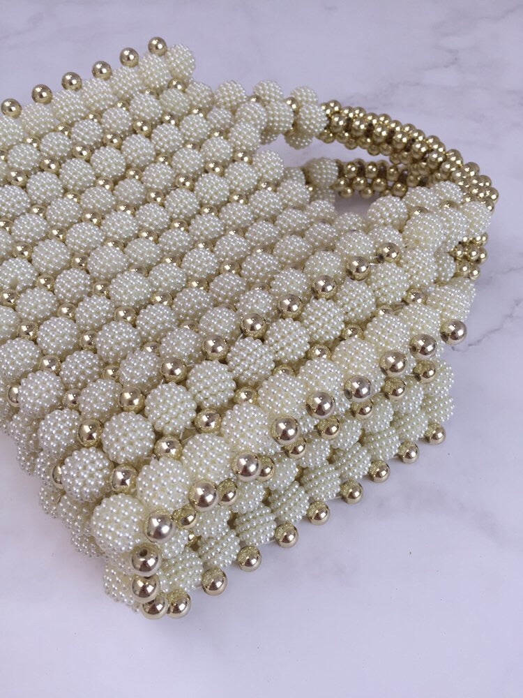Bolso tejido perlas dorado