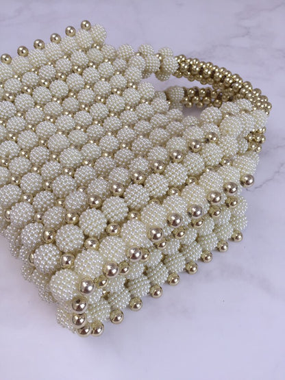 Bolso tejido perlas dorado