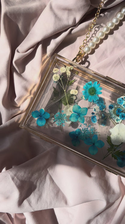 Bolso clutch flores preservadas